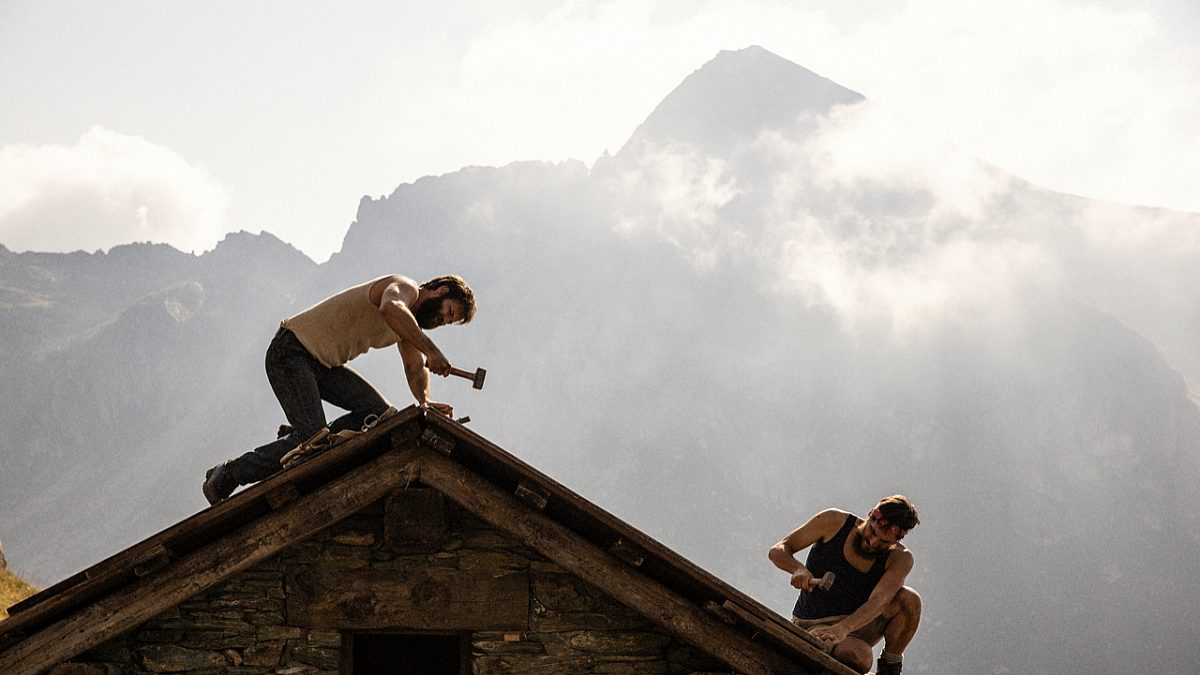 2 men working on a rooftop